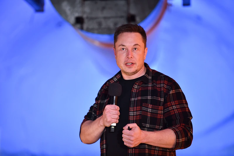 US-SCIENCE-TECHNOLOGY-COMPUTERS-TRANSPORT-TUNNEL-BORING-MUSK
Elon Musk, co-founder and chief executive officer of Tesla Inc., speaks during an unveiling event for the Boring Company Hawthorne test tunnel in Hawthorne, south of Los Angeles, California on December 18, 2018. - Musk explained that the snail moves 14 times faster than a tunnel-digging machine. On Tuesday night December 18, 2018, Boring Co. officially opened the Hawthorne tunnel, a preview of Elon Musk's larger vision to ease L.A. traffic. (Photo by Robyn Beck / POOL / AFP) (Photo credit should read ROBYN BECK/AFP via Getty Images)