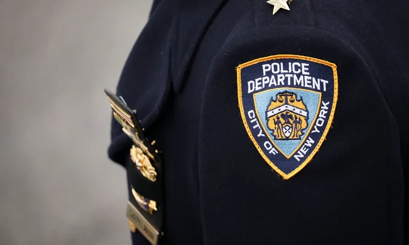 Funeral Held For NYPD Detective Killed During Attempted Robbery In Queens HAMPTON BAYS, NY - FEBRUARY 20: An NYPD officer arrives for the funeral service of fallen NYPD Detective Brian Simonsen at the Church of St. Rosalie, February 20, 2019 in Hampton Bays, New York. Thousands of area police officers and law enforcement personnel attended the funeral. Simonsen was killed by friendly fire while responding with fellow NYPD officers to a robbery at a store in Queens last week. Simonsen is survived by his wife and mother and will be interned at Jamesport Cemetery in nearby Riverhead, New York. (Photo by Drew Angerer/Getty Images)