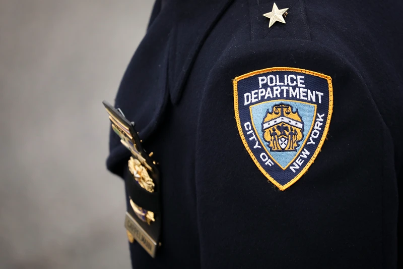 Funeral Held For NYPD Detective Killed During Attempted Robbery In Queens HAMPTON BAYS, NY - FEBRUARY 20: An NYPD officer arrives for the funeral service of fallen NYPD Detective Brian Simonsen at the Church of St. Rosalie, February 20, 2019 in Hampton Bays, New York. Thousands of area police officers and law enforcement personnel attended the funeral. Simonsen was killed by friendly fire while responding with fellow NYPD officers to a robbery at a store in Queens last week. Simonsen is survived by his wife and mother and will be interned at Jamesport Cemetery in nearby Riverhead, New York. (Photo by Drew Angerer/Getty Images)