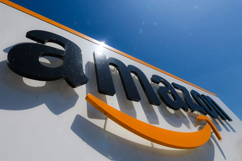 A picture shows the Amazon logo at the entrance of the Amazon logistics centre in Amiens, northern France, on July 23, 2019. (Photo by DENIS CHARLET / AFP) (Photo credit should read DENIS CHARLET/AFP via Getty Images)