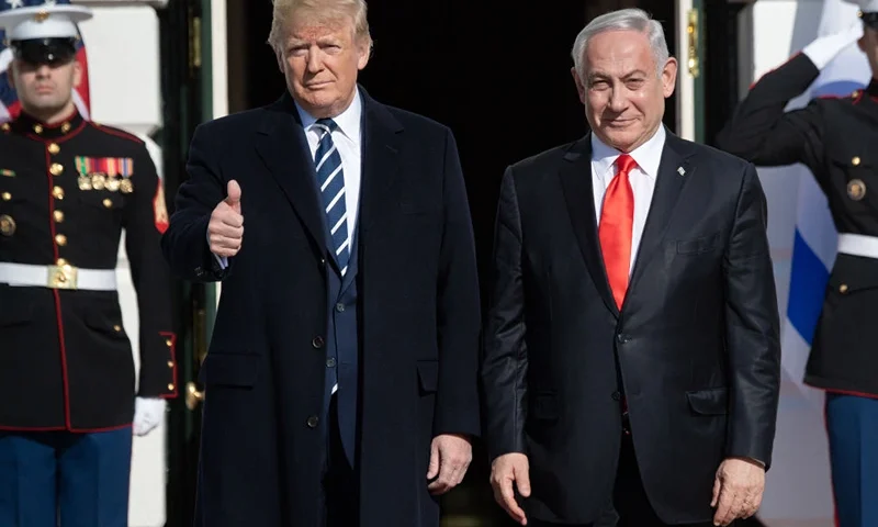 TOPSHOT - US President Donald Trump greets Israeli Prime Minister Benjamin Netanyahu as he arrives for meeting on the South Lawn of the White House in Washington, DC, January 27, 2020. (Photo by SAUL LOEB / AFP) (Photo by SAUL LOEB/AFP via Getty Images)