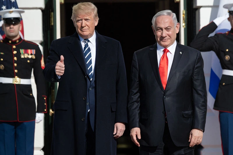 TOPSHOT - US President Donald Trump greets Israeli Prime Minister Benjamin Netanyahu as he arrives for meeting on the South Lawn of the White House in Washington, DC, January 27, 2020. (Photo by SAUL LOEB / AFP) (Photo by SAUL LOEB/AFP via Getty Images)