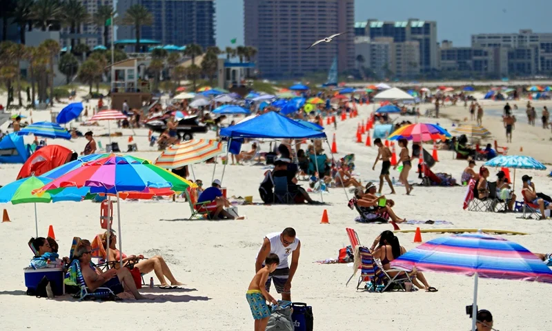 Coronavirus Pandemic Causes Climate Of Anxiety And Changing Routines In America CLEARWATER, FL - MAY 04: People visit Clearwater Beach after Governor Ron DeSantis opened the beaches at 7am on May 04, 2020 in Clearwater, Florida. Restaurants, retailers, beaches and some state parks reopen today with caveats, as the state continues to ease restrictions put in place to contain COVID-19. (Photo by Mike Ehrmann/Getty Images)