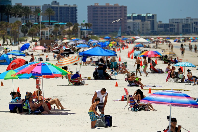 Coronavirus Pandemic Causes Climate Of Anxiety And Changing Routines In America
CLEARWATER, FL - MAY 04: People visit Clearwater Beach after Governor Ron DeSantis opened the beaches at 7am on May 04, 2020 in Clearwater, Florida. Restaurants, retailers, beaches and some state parks reopen today with caveats, as the state continues to ease restrictions put in place to contain COVID-19. (Photo by Mike Ehrmann/Getty Images)