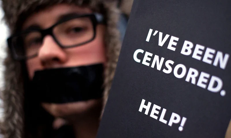 Demonstrators protest outside the Houses of Parliament in London against the proposed Digital Rights Bill, on March 24, 2010. The Open Rights Group organised the event to highlight what they believe to be a potential threat to freedom of speech and information through restrictions and disconnections of people believed to be infringing copyright laws. AFP PHOTO/Leon Neal (Photo by LEON NEAL / AFP) (Photo by LEON NEAL/AFP via Getty Images)