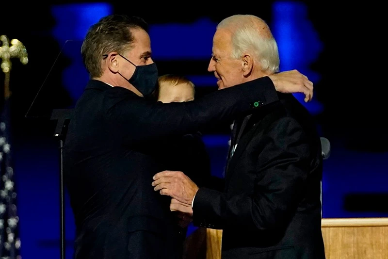 WILMINGTON, DELAWARE - NOVEMBER 07: President-elect Joe Biden embraces his son Hunter Biden after addressing the nation from the Chase Center November 07, 2020 in Wilmington, Delaware. After four days of counting the high volume of mail-in ballots in key battleground states due to the coronavirus pandemic, the race was called for Biden after a contentious election battle against incumbent Republican President Donald Trump. (Photo by Andrew Harnik-Pool/Getty Images)