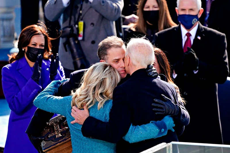 US President Joe Biden(R) is comforted by his son Hunter Biden and First Lady Jill Biden after being sworn in during the 59th presidential inauguration in Washington, DC on the West Front of the US Capitol on January 20, 2021 in Washington, DC. - During today's inauguration ceremony Joe Biden became the 46th president of the United States. (Photo by Kevin Dietsch / POOL / AFP) (Photo by KEVIN DIETSCH/POOL/AFP via Getty Images)