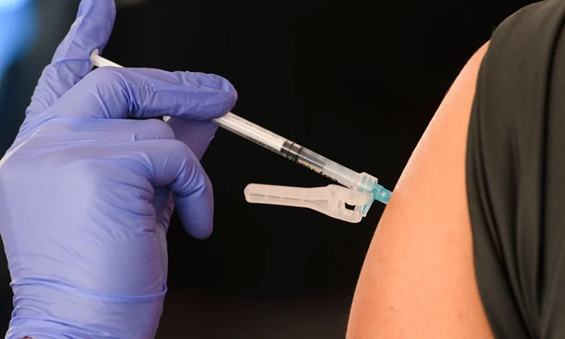 An education worker receives a vaccination at a mass vaccination site in a parking lot at Hollywood Park adjacent to SoFi stadium during the Covid-19 pandemic on March 1, 2021 in Inglewood, California. - The vaccination site is part of a plan from the Los Angeles Unified School District (LAUSD) and State of California to reopen all district elementary schools by mid-April. (Photo by Patrick T. FALLON / AFP) (Photo by PATRICK T. FALLON/AFP via Getty Images)