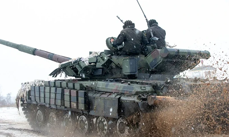 Ukrainian Military Forces servicemen of the 92nd mechanized brigade use tanks, self-propelled guns and other armored vehicles to conduct live-fire exercises near the town of Chuguev, in Kharkiv region, on February 10, 2022. - Russia's deployment for a military exercise in Belarus and on the borders of Ukraine marks a "dangerous moment" for European security, NATO's chief said on February 10, 2022. (Photo by Sergey BOBOK / AFP) (Photo by SERGEY BOBOK/AFP via Getty Images)