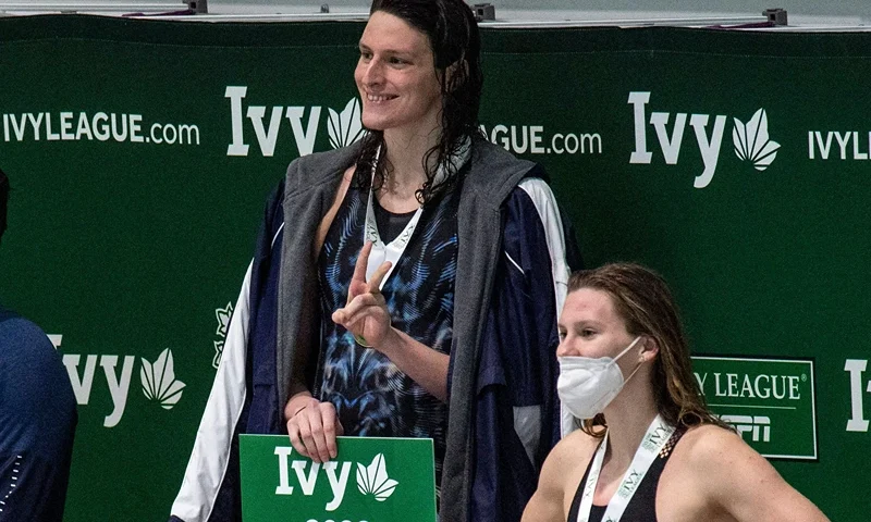 Transgender swimmer Lia Thomas (2nd L) of Penn University and transgender swimmer Iszac Henig (L) of Yale pose with their medals after placing first and second in the 100-yard freestyle swimming race at the 2022 Ivy League Women's Swimming & Diving Championships at Harvard University in Cambridge, Massachusetts on February 19, 2022. - Thomas took first place with a time of 47.63 and Henig took second place with a time of 47.82. (Photo by Joseph Prezioso / AFP) (Photo by JOSEPH PREZIOSO/AFP via Getty Images)