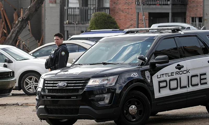 LITTLE ROCK, AR - MARCH 31: Police help residents evacuate the Calais apartment complex on March 31, 2023 in Little Rock, Arkansas. Tornados damaged hundreds of homes and buildings Friday afternoon across a large part of Central Arkansas. Governor Sarah Huckabee Sanders declared a state of emergency after the catastrophic storms that hit on Friday afternoon. According to local reports, the storms killed at least three people. (Photo by Benjamin Krain/Getty Images)