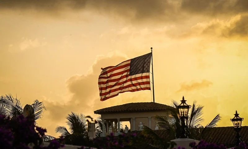 The US flag flies on top of the Mar-a-Lago Club, home of former US President Donald Trump, in Palm Beach, Florida, on April 1, 2023. - Trump is expected to surrender to the authorities in New York on April 4, 2023 to face charges over a hush-money payment to porn star Stormy Daniels. (Photo by Giorgio Viera / AFP) (Photo by GIORGIO VIERA/AFP via Getty Images)