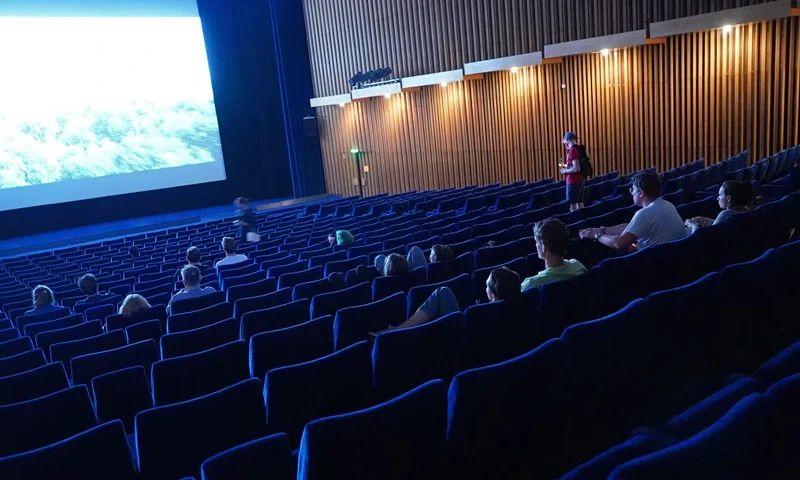 People arrive to watch a late night film at Kino International on the first day that cinemas reopened in Berlin during the novel coronavirus pandemic on July 02, 2020 in Berlin, Germany. Germany is continuing to lift lockdown restrictions nationwide while at the same time remaining wary of possible further outbreaks. (Photo by Sean Gallup/Getty Images)