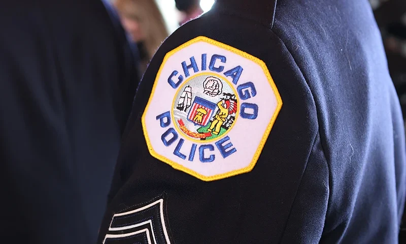 Chicago Police officers monitor the area outside of the Chicago Mercy Hospital where a gunman opened fire in Chicago on November 19, 2018. - An argument in a hospital parking lot escalated into a shooting that killed three people, including a police officer, in the US city of Chicago on November 19, 2018. The violence only ended when police engaged in shootout with the gunman inside Mercy Hospital. "We have four deceased individuals: police officer, two female staff employees at the hospital, and the offender," police Superintendent Eddie Johnson told journalists. (Photo by KAMIL KRZACZYNSKI / AFP) (Photo by KAMIL KRZACZYNSKI/AFP via Getty Images)