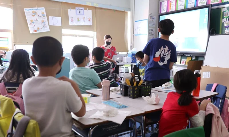 NEW YORK, NEW YORK - JUNE 24: Students attend class on the second to last day of school as New York City public schools prepare to wrap up the year at Yung Wing School P.S. 124 on June 24, 2022 in New York City. Approximately 75% of NYC public schools enrolled fewer students for the 2021/2022 school year due to the pandemic. (Photo by Michael Loccisano/Getty Images)