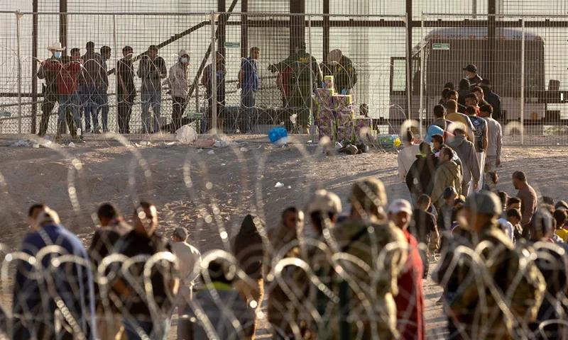 EL PASO, TEXAS - MAY 12: Immigrants wait to be transported and processed by U.S. Border Patrol agents at the U.S.-Mexico border on May 12, 2023 in El Paso, Texas. The U.S. Covid-era Title 42 immigration policy ended the night before, and migrants entering the system now are anxious over how the change may affect their asylum claims. (Photo by John Moore/Getty Images)