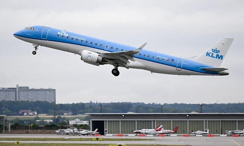 GERMANY-TRANSPORT-AVIATION-TOURISM-HOLIDAYS An Embraer 190 Cityhopper passenger plane of Dutch airline KLM takes off from Stuttgart Airport in Leinfelden-Echterdingen near Stuttgart, southwestern Germany, on July 28, 2023. (Photo by THOMAS KIENZLE / AFP) (Photo by THOMAS KIENZLE/AFP via Getty Images)