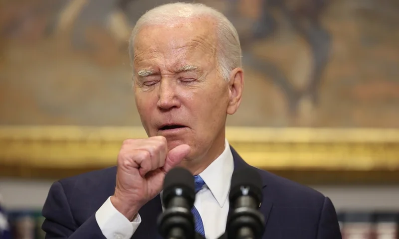 President Biden Speaks On The United Auto Workers Strike And Their Ongoing Contract Negotiations With The Big 3 Automakers WASHINGTON, DC - SEPTEMBER 15: U.S. President Joe Biden coughs as he delivers remarks on the contract negotiations between the United Auto Workers and auto companies in the Roosevelt Room at the White House on September 15, 2023 in Washington, DC. The United Auto Workers authorized a strike for the first time since 2019 amid negotiations with Ford, General Motors and Stellantis. (Photo by Kevin Dietsch/Getty Images)