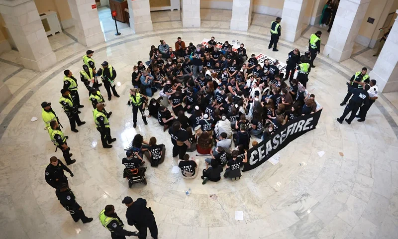 WASHINGTON, DC - OCTOBER 18: Capitol Police officers respond as protesters hold a demonstration in support of a cease-fire against the Palestinians in Gaza in the Cannon House Office Building on October 18, 2023 in Washington, DC. Members of the Jewish Voice for Peace and the IfNotNow movement staged a rally to call for a cease-fire in the Israel–Hamas war. (Photo by Joe Raedle/Getty Images)