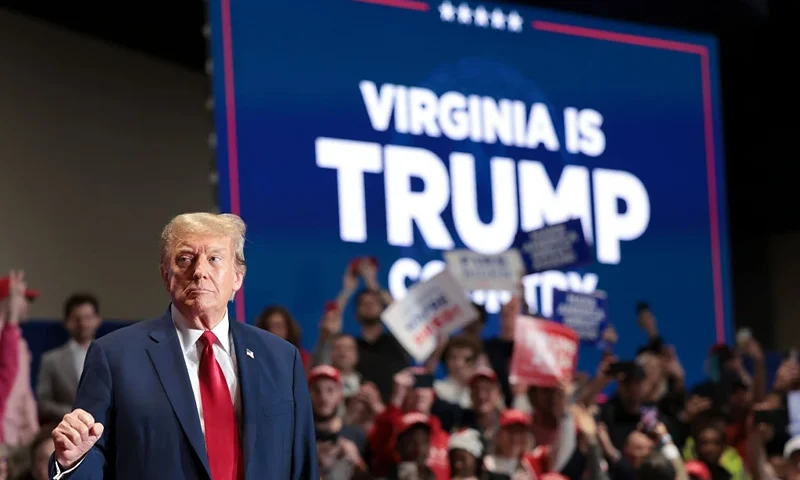 RICHMOND, VIRGINIA - MARCH 02: Republican presidential candidate and former President Donald Trump reacts to supporters as he arrives on stage during a Get Out the Vote Rally March 2, 2024 in Richmond, Virginia. Sixteen states, including Virginia, will vote during Super Tuesday on March 5. (Photo by Win McNamee/Getty Images)