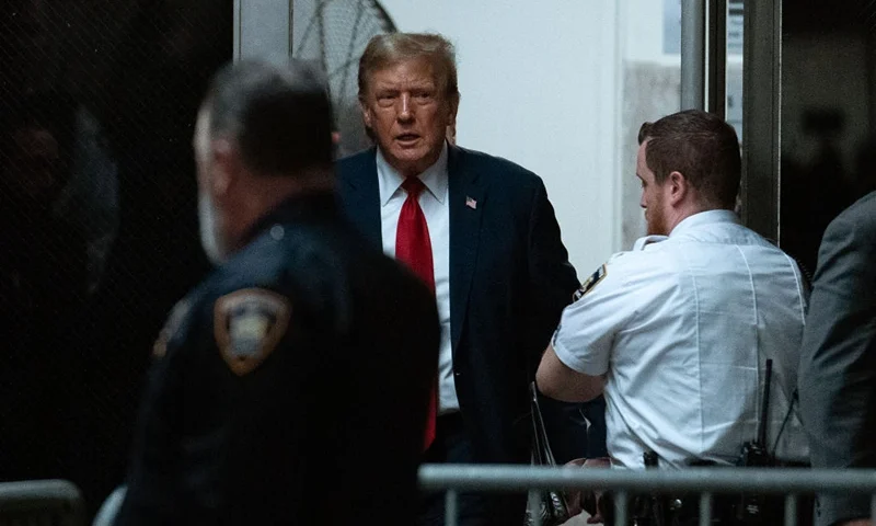 NEW YORK, NEW YORK - APRIL 15: Former U.S. President Donald Trump returns to the courtroom after a break during the start of jury selection for his trial at Manhattan Criminal Court on April 15, 2024 in New York City. Former President Donald Trump faces 34 felony counts of falsifying business records in the first of his criminal cases to go to trial. (Photo by Jeenah Moon-Pool/Getty Images)