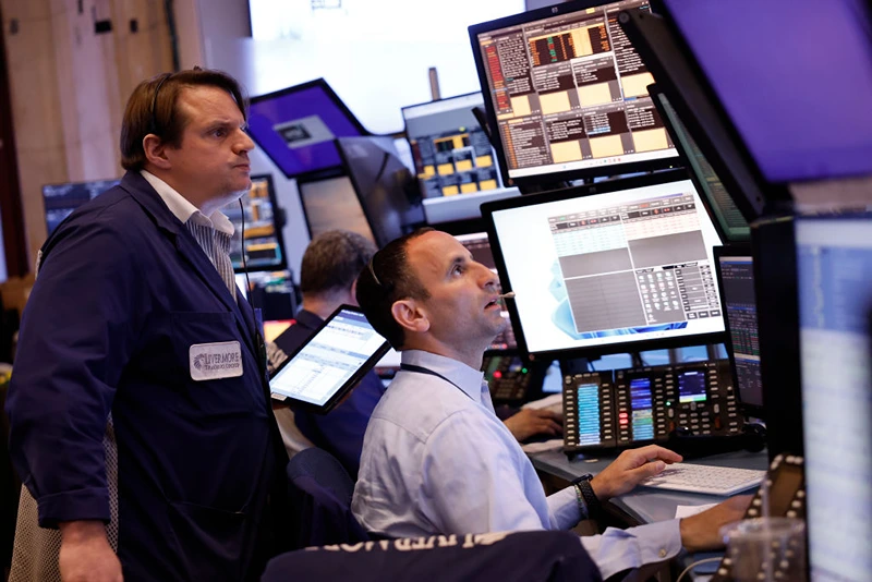 NEW YORK, NEW YORK - APRIL 29: Traders work on the floor of the New York Stock Exchange during morning trading on April 29, 2024 in New York City. Stocks opened high Monday morning amid a Federal Reserve rate decision and the monthly jobs report later this week. (Photo by Michael M. Santiago/Getty Images)