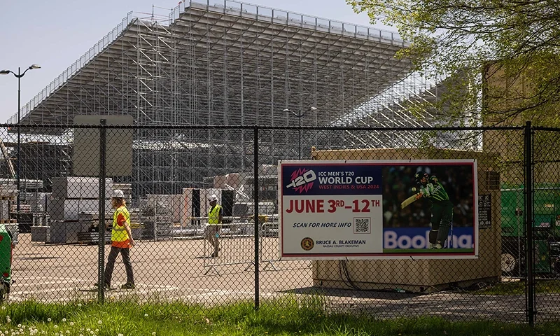 A poster of the upcoming ICC Men's T20 World Cup is displayed outside the Nassau county International Cricket Stadium in Eisenhower Park in East Meadow on May 1, 2024 in New York. Nassau County International Cricket Stadium under construction in Eisenhower Park in East Meadow, New York, ahead of the ICC T20 World Cup 2024. The newly-built Nassau County International Cricket Stadium, near New York, was launched on May 15, 2024 with the sport's world body "excited" to conquer new territories through the T20 World Cup in June. The 34,000-capacity stadium, with infrastructure from the Las Vegas Formula 1 circuit and drop-in pitches prepared in Florida, will host the hotly-anticipated India-Pakistan clash on June 9, among its eight scheduled World Cup games. (Photo by Yuki IWAMURA / AFP) (Photo by YUKI IWAMURA/AFP via Getty Images)