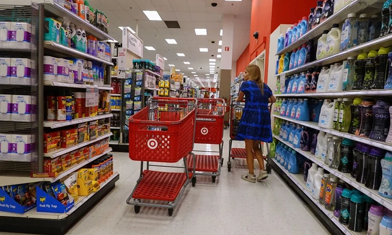 MIAMI, FLORIDA - MAY 20: A customer shops at a Target store on May 20, 2024 in Miami, Florida. Target announced plans to cut prices on thousands of consumer basics as inflation cuts into household budgets. (Photo by Joe Raedle/Getty Images)