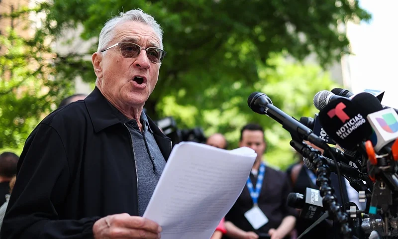 US actor Robert De Niro speaks in support of US President Joe Biden outside of Manhattan Criminal Court as former US President and Republican presidential candidate Donald Trump attends his criminal trial for allegedly covering up hush money payments in New York City, on May 28, 2024. De Niro on Tuesday spoke outside the New York court where Donald Trump is standing trial, branding him a dangerous "clown" who will become a dictator for life if reelected. De Niro, a longtime political activist and critic of Trump, has taken a growing role in the campaign to reelect Joe Biden, including starring in a new hard-hitting TV ad for the Democratic Party. (Photo by Charly TRIBALLEAU / AFP) (Photo by CHARLY TRIBALLEAU/AFP via Getty Images)