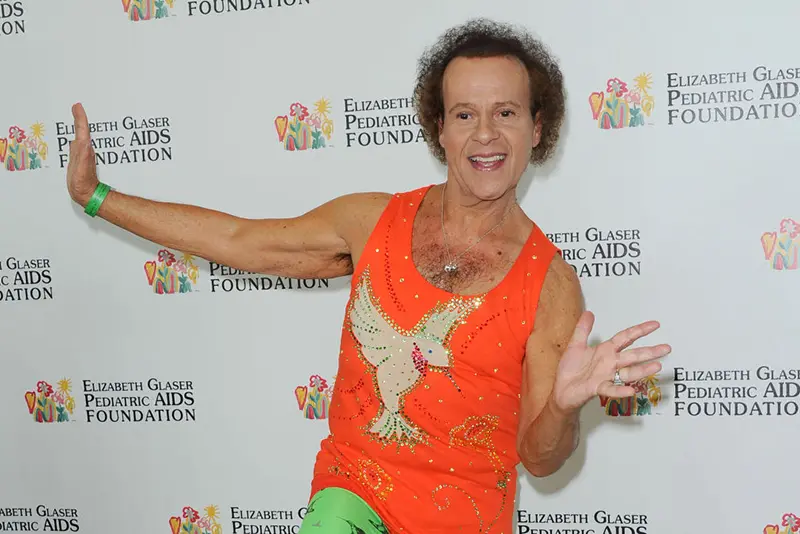 US fitness coach Richard Simmons attends the 2013 "A Time For Heroes" held at the century park in Los Angeles, June 2, 2013. Richard Simmons, Legendary Fitness Guru and TV Personality, Dies at 76. (Photo by Chris DELMAS / AFP) (Photo by CHRIS DELMAS/AFP via Getty Images)