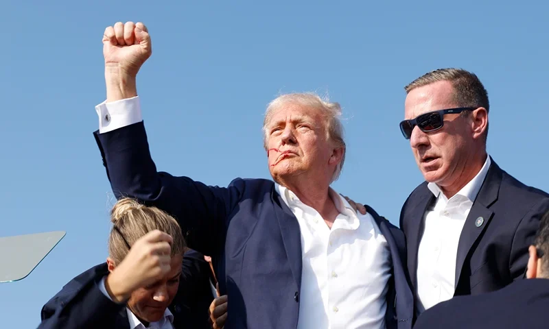 BUTLER, PENNSYLVANIA - JULY 13: Republican presidential candidate former President Donald Trump is rushed offstage during a rally on July 13, 2024 in Butler, Pennsylvania. Butler County district attorney Richard Goldinger said the shooter is dead after injuring former U.S. President Donald Trump, killing one audience member and injuring another in the shooting. (Photo by Anna Moneymaker/Getty Images