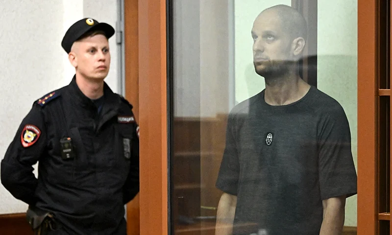 US journalist Evan Gershkovich, accused of espionage, stands inside a glass defendants' cage during the verdict announcement at the Sverdlovsk Regional Court in Yekaterinburg on July 19, 2024. (Photo by Alexander NEMENOV / AFP) (Photo by ALEXANDER NEMENOV/AFP via Getty Images)