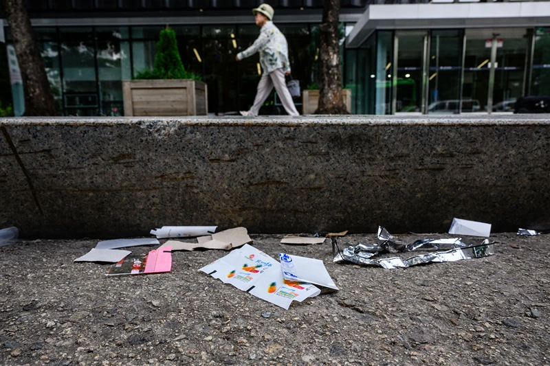 TOPSHOT-SKOREA-NKOREA-BALLOONS-POLITICS
TOPSHOT - A pedestrian walks along a pavement past pieces of North Korean food packaging, sweet wrappers and paper suspected to be from trash balloons sent from North Korea, in Seoul on July 24, 2024. North Korean sweet wrappers and packets of crackers and other snacks made at a factory once visited by leader Kim Jong Un were found by AFP reporters on Seoul streets on July 24. (Photo by Anthony WALLACE / AFP) (Photo by ANTHONY WALLACE/AFP via Getty Images)