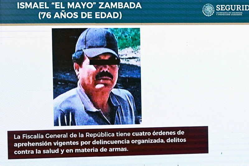 A picture of Sinaloa cartel co-founder, Mexican drug trafficker Ismael "Mayo" Zambada, is seen on screen during Mexican President Andres Manuel Lopez Obrador's usual morning press conference at the National Palace in Mexico City on July 26, 2024. Mexican authorities did not participate in the arrest of Ismael "Mayo" Zambada, co-founder of the Sinaloa cartel, and a son of Joaquin "El Chapo" Guzman, carried out on July 25 in Texas by US authorities, the Mexican Security Secretary announced on Friday. (Photo by ALFREDO ESTRELLA / AFP) (Photo by ALFREDO ESTRELLA/AFP via Getty Images)