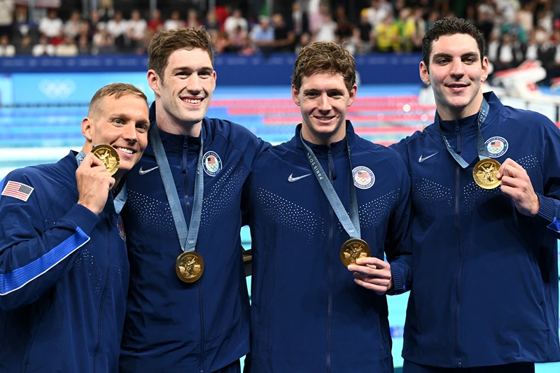 SWIMMING-OLY-PARIS-2024-MEDALS
Gold medallists US' Jack Alexy, US' Chris Guiliano, US' Hunter Armstrong and US' Caeleb Dressel pose with their medals following the men's 4x100m freestyle relay swimming event at the Paris La Defense Arena in Nanterre, west of Paris, on July 27, 2024. (Photo by SEBASTIEN BOZON / AFP) (Photo by SEBASTIEN BOZON/AFP via Getty Images)