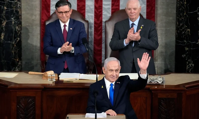 WASHINGTON, DC - JULY 24: Israeli Prime Minister Benjamin Netanyahu addresses a joint meeting of Congress as Speaker of the House Mike Johnson (R-LA) and U.S. Sen. Ben Cardin (D-MD) listen in the chamber of the House of Representatives at the U.S. Capitol on July 24, 2024 in Washington, DC. Netanyahu’s visit occurs as the Israel-Hamas war reaches nearly ten months. A handful of Senate and House Democrats boycotted the remarks over Israel’s treatment of Palestine. (Photo by Kent Nishimura/Getty Images)WASHINGTON, DC - JULY 24: Israeli Prime Minister Benjamin Netanyahu addresses a joint meeting of Congress as Speaker of the House Mike Johnson (R-LA) and U.S. Sen. Ben Cardin (D-MD) listen in the chamber of the House of Representatives at the U.S. Capitol on July 24, 2024 in Washington, DC. Netanyahu’s visit occurs as the Israel-Hamas war reaches nearly ten months. A handful of Senate and House Democrats boycotted the remarks over Israel’s treatment of Palestine. (Photo by Kent Nishimura/Getty Images)