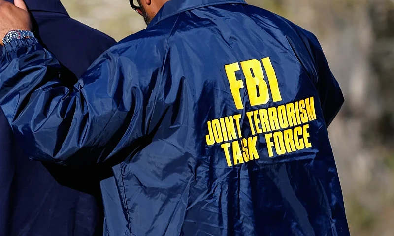 SAN BERNARDINO, CA - DECEMBER 02: Members of the FBI Joint Terrorism Task Force stand outside of a press conference regarding the shooting that occurred at the Inland Regional Center on December 2, 2015 in San Bernardino, California. Multiple fatalities were reported as police search for up to three suspects who are still at large. (Photo by Sean M. Haffey/Getty Images)