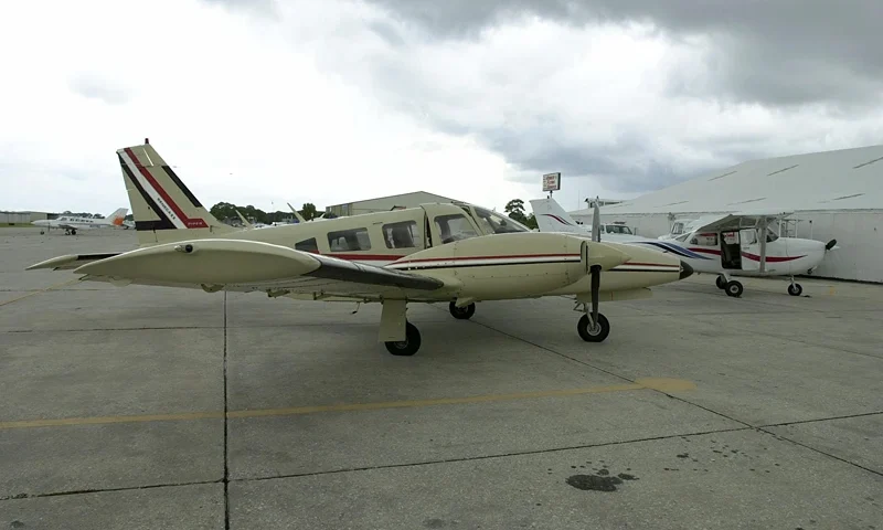 A Seneca II Piper twin engine airplane, used to tr VENICE, UNITED STATES: A Seneca II Piper twin engine airplane, used to train the two suspected terrorists linked to the World Trade Center attack according to Rudi Deckkers, president and owner of Huffman Aviation, sits on the Huffman Aviation runway 12 September 2001 in Venice, Florida. The other plane reportedly used, a Cessna Skyhawk single engine, is at rear. AFP PHOTO/Peter MUHLY (Photo credit should read PETER MUHLY/AFP via Getty Images)