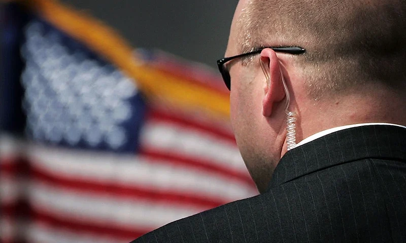 PRESTWICK, UNITED KINGDOM - JULY 06: A secret service agent stands before the arrival of U.S. President George W. Bush at Prestwick Airport July 6, 2005 in Prestwick, Scotland. Leaders of the worlds richest countrys arrive in Scotland July 6 for the three-day G8 Summit at the Gleneagles Hotel. (Photo by Bruno Vincent/Getty Images)