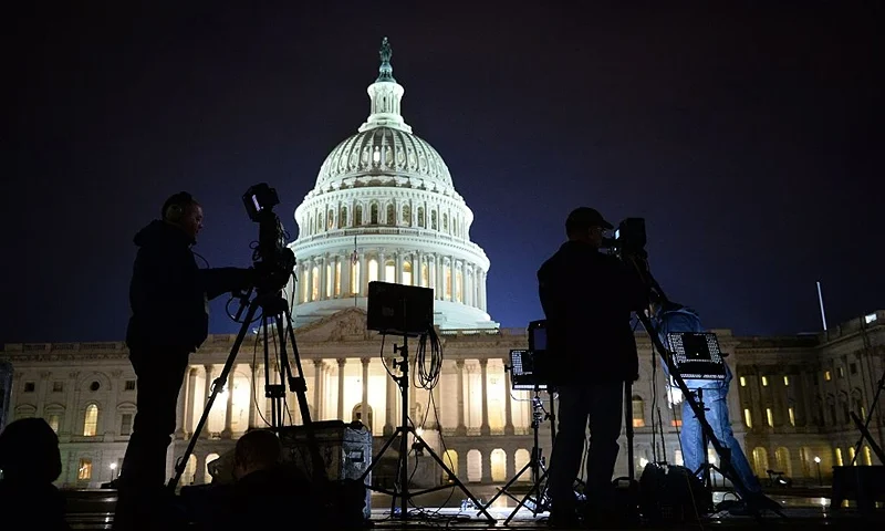 TOPSHOT - The US Capitol Building is pictured as media gather on January 20, 2017 in Washington, DC. Donald Trump will be sworn in as the 45th president of the United States Friday -- capping his improbable journey to the White House and beginning a four-year term that promises to shake up Washington and the world. / AFP / Robyn Beck (Photo credit should read ROBYN BECK/AFP via Getty Images)