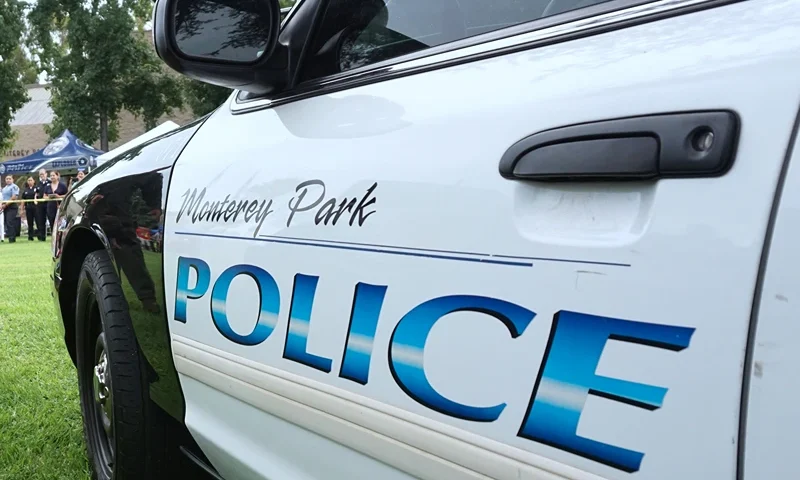 US-SOCIETY-COMMUNITY-SECURITY A K9 dog is lead to a police vehicel during a display by the Monterey Park police department at a "Night Out" activity on August 1, 2017 in Monterey Park, California One of hundreds of such activites expected to take place across the country for National Night Out, which began over 30 years ago with a call for people to hold small public gatherings in a take-back-the-streets show of community pride which, over the years, has grown to include block parties, parades, movie screenings and picnics. / AFP PHOTO / FREDERIC J. BROWN (Photo credit should read FREDERIC J. BROWN/AFP via Getty Images)