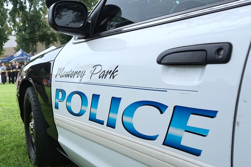 US-SOCIETY-COMMUNITY-SECURITY
A K9 dog is lead to a police vehicel during a display by the Monterey Park police department at a "Night Out" activity on August 1, 2017 in Monterey Park, California One of hundreds of such activites expected to take place across the country for National Night Out, which began over 30 years ago with a call for people to hold small public gatherings in a take-back-the-streets show of community pride which, over the years, has grown to include block parties, parades, movie screenings and picnics. / AFP PHOTO / FREDERIC J. BROWN (Photo credit should read FREDERIC J. BROWN/AFP via Getty Images)