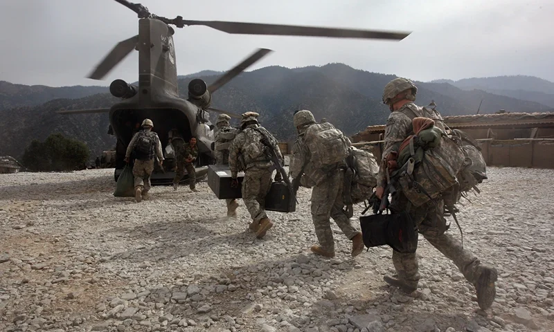 KORENGAL VALLEY, AFGHANISTAN - OCTOBER 27: U.S. soldiers board an Army Chinook transport helicopter after it brought fresh soldiers and supplies to the Korengal Outpost on October 27, 2008 in the Korengal Valley, Afghanistan. The military spends huge effort and money to fly in supplies to soldiers of the 1-26 Infantry based in the Korengal Valley, site of some of the fiercest fighting of the Afghan war. The unpaved road into the remote area is bad and will become more treacherous with the onset of winter. (Photo by John Moore/Getty Images)