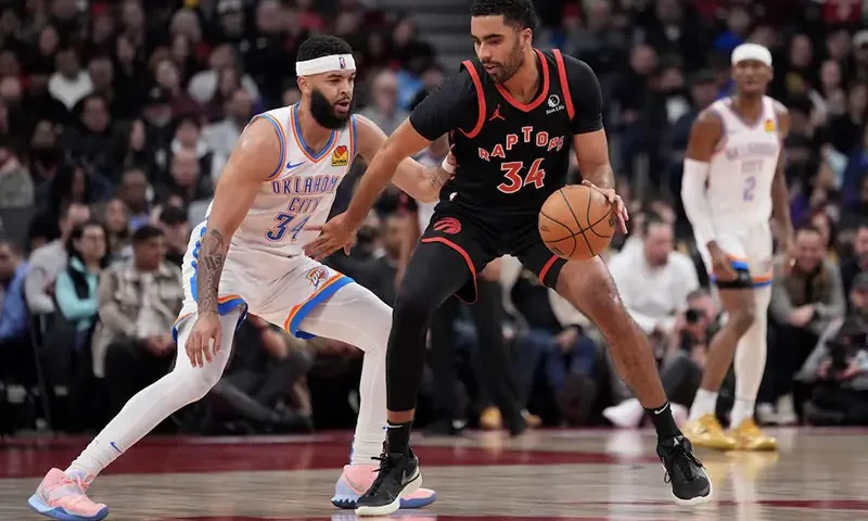 Toronto Raptors forward Jontay Porter (34) controls the ball against Oklahoma City Thunder forward Kenrich Williams (34) during the first half at Scotiabank Arena. Mandatory Credit: John E. Sokolowski-USA TODAY Sports/File Photo