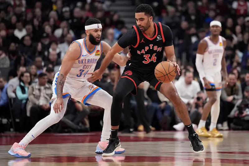 Toronto Raptors forward Jontay Porter (34) controls the ball against Oklahoma City Thunder forward Kenrich Williams (34) during the first half at Scotiabank Arena. Mandatory Credit: John E. Sokolowski-USA TODAY Sports/File Photo