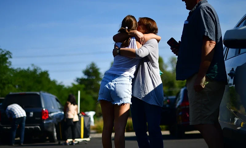 BOULDER, CO - AUGUST 18: Incoming freshman Margot Strother, 18, embraces her mother after moving into a campus dormitory at University of Colorado Boulder on August 18, 2020 in Boulder, Colorado. Due to the coronavirus pandemic, many colleges and universities are instituting different strategies this fall semester, with most students living on campus attending all classes with remote instruction. (Photo by Mark Makela/Getty Images)