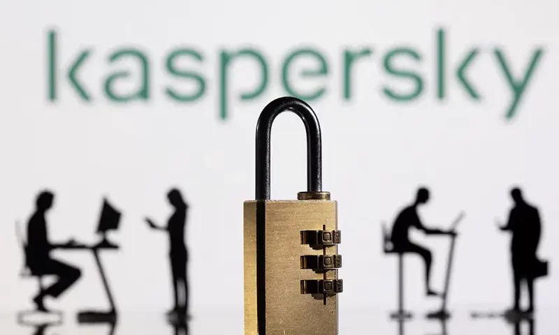 3D printed models of people working on computers and padlock are seen in front of a displayed Kaspersky logo in this picture illustration taken, February 1, 2022. REUTERS/Dado Ruvic/Illustration/File Photo