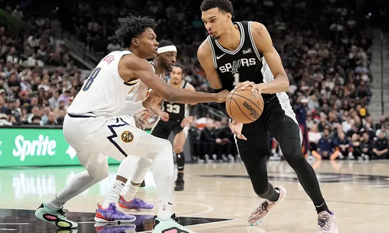 San Antonio Spurs forward Victor Wembanyama (1) drives to the basket against Denver Nuggets forward Peyton Watson (8) during the first half at Frost Bank Center. Mandatory Credit: Scott Wachter-USA TODAY Sports/File Photo