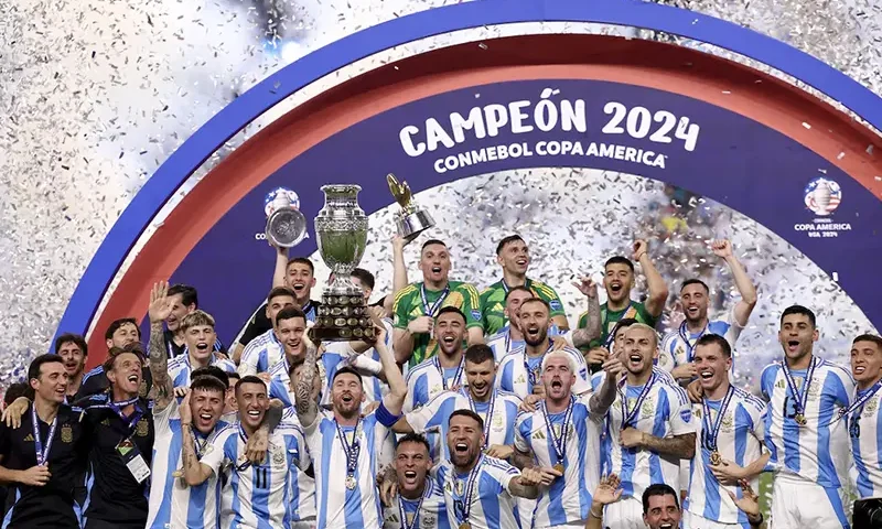 Argentina's Lionel Messi lifts the trophy as he celebrates with teammates after winning Copa America 2024 REUTERS/Agustin Marcarian