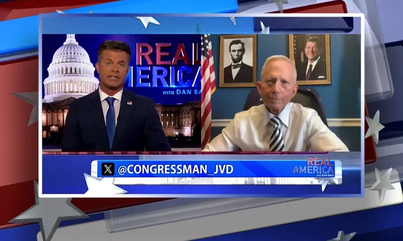 Video still from Real America on One America News Network showing a split screen of the host on the left side, and on the right side is the guest, Rep. Jeff Van Drew.